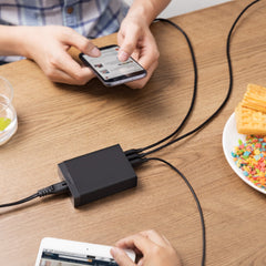 Anker PowerPort 6 port layout showing organized charging on a desk.
