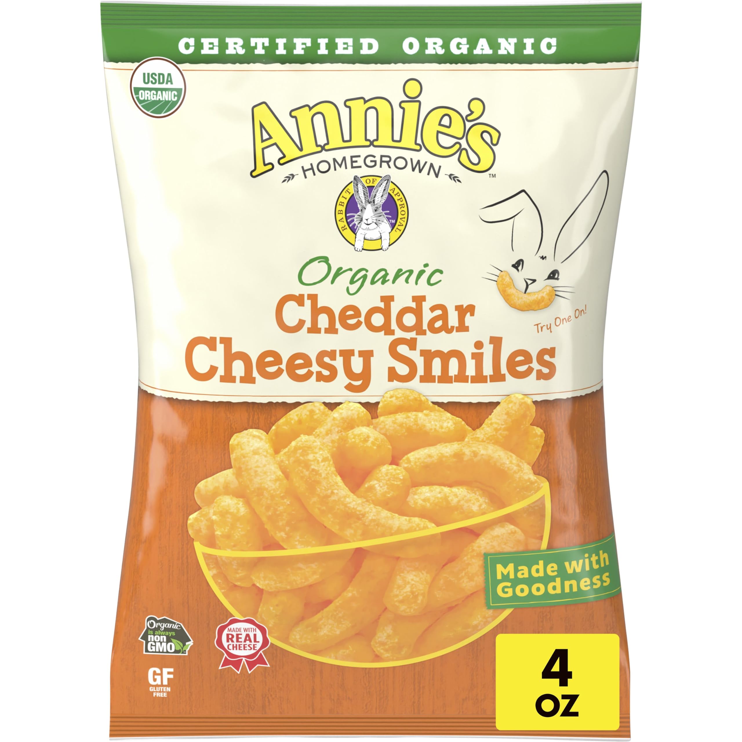 Annie's Organic Cheddar Cheesy Smiles baked puffs in bag, gluten-free kid-friendly snack.