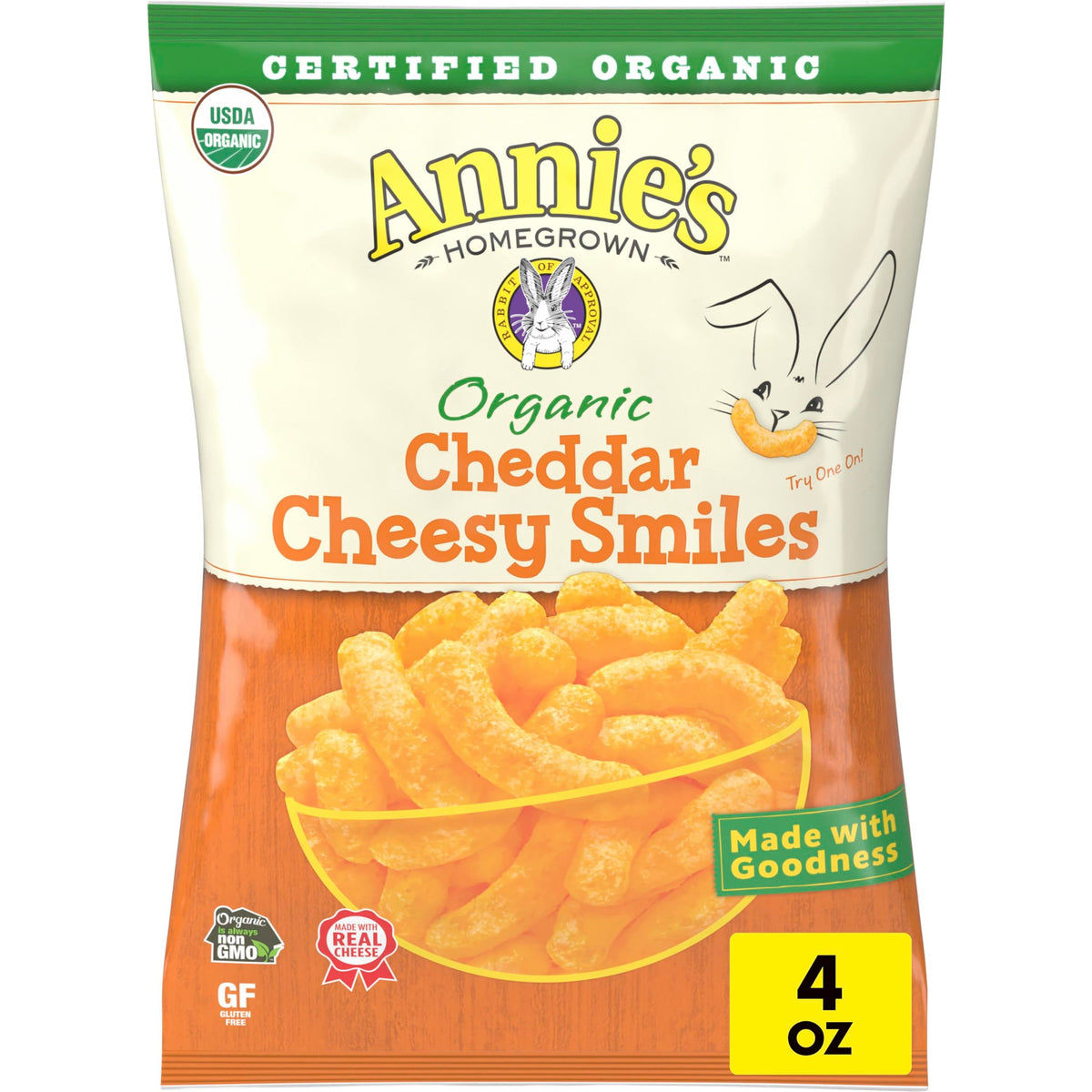 Annie's Organic Cheddar Cheesy Smiles baked puffs in bag, gluten-free kid-friendly snack.