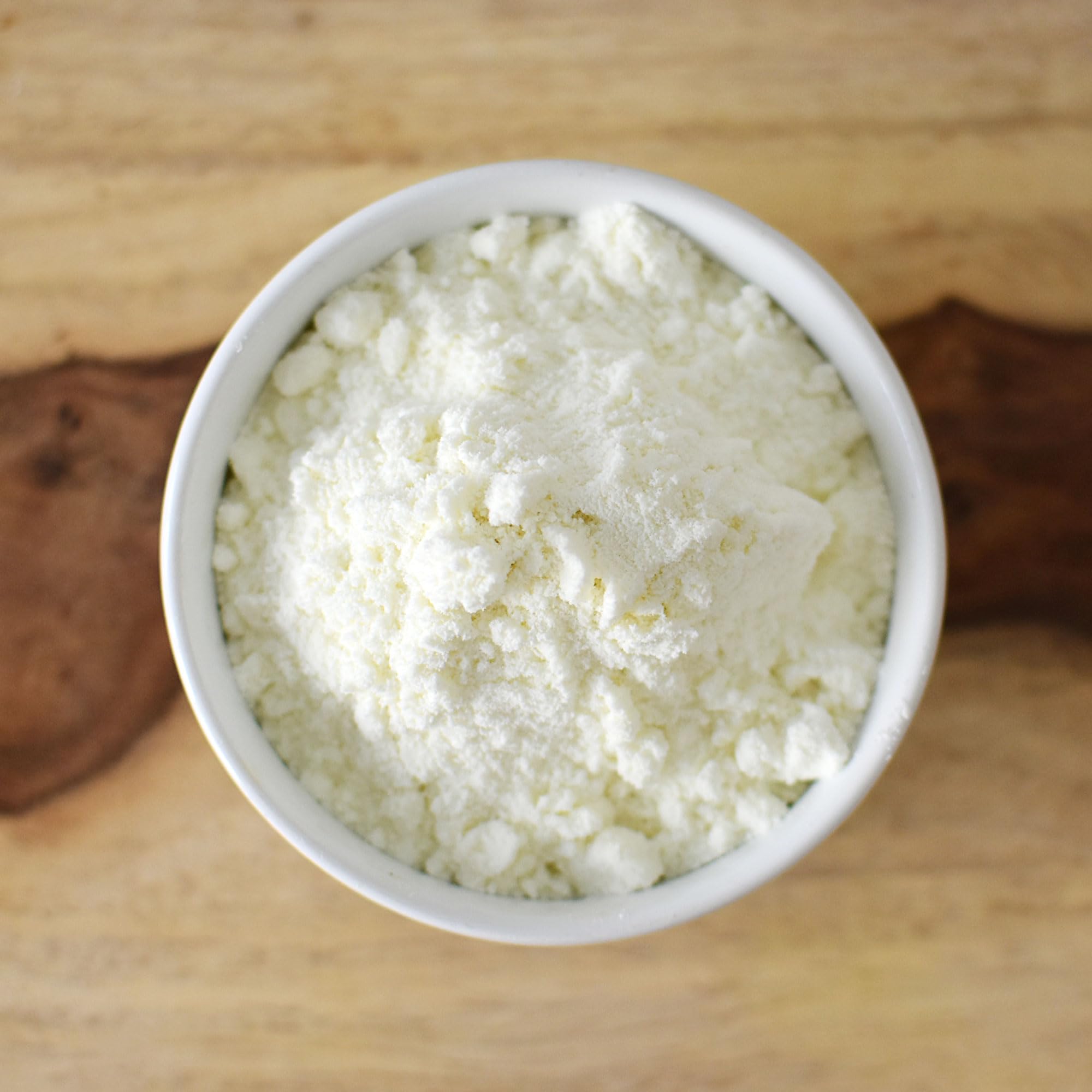 Anthony's goat milk powder baking-dough scene highlights dairy richness for treats