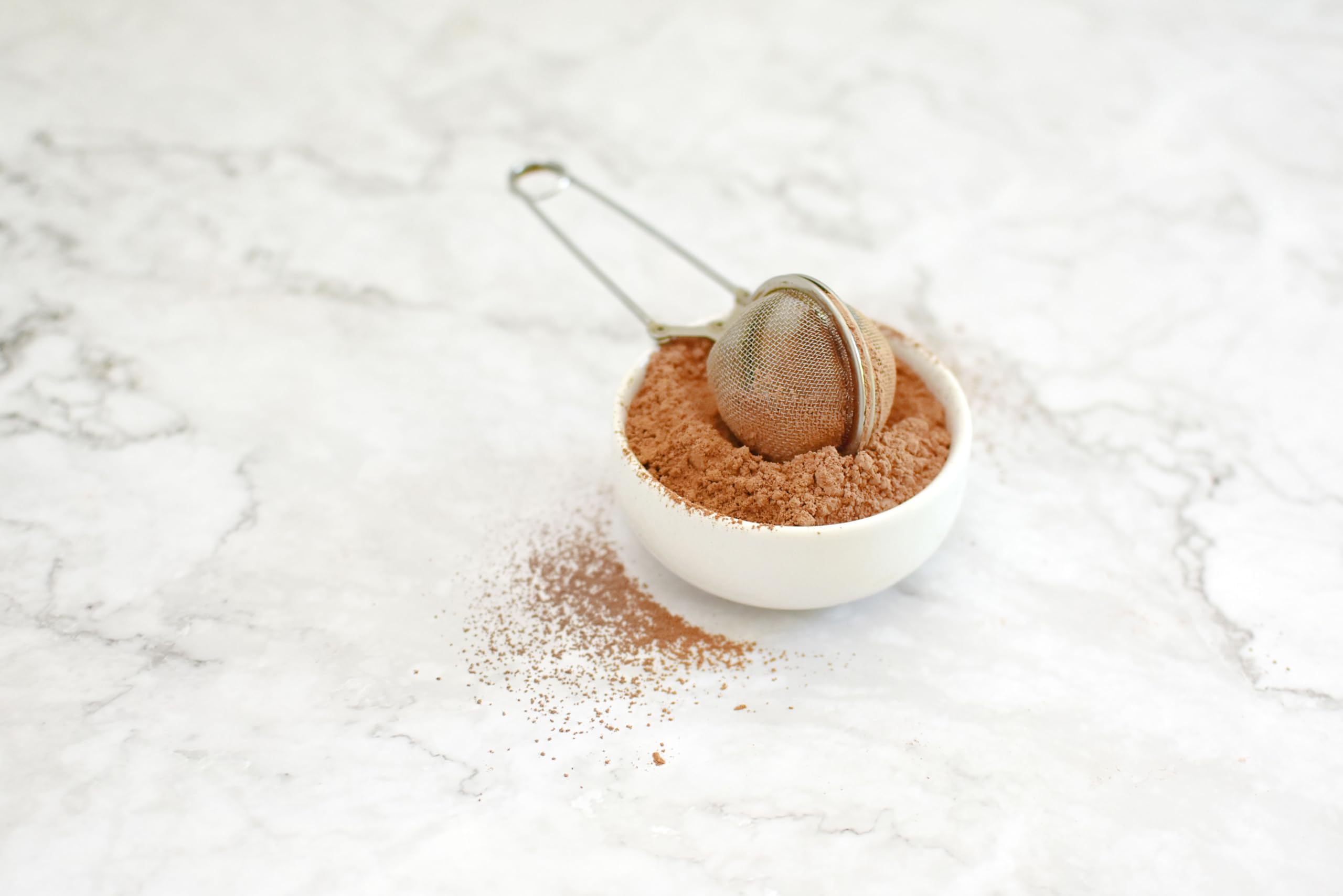 Anthony's Organic Cocoa Powder on pantry shelf with gluten-free ingredients