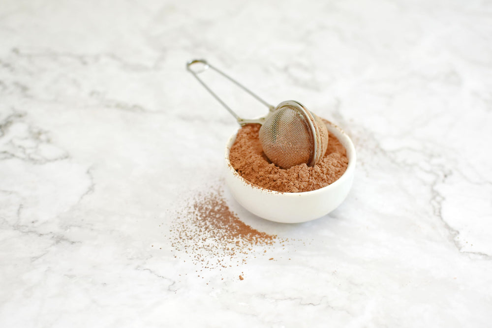 Anthony's Organic Cocoa Powder on pantry shelf with gluten-free ingredients