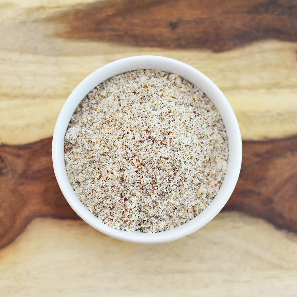 Measuring cup with Anthonys Almond Meal Flour ready for gluten-free recipes