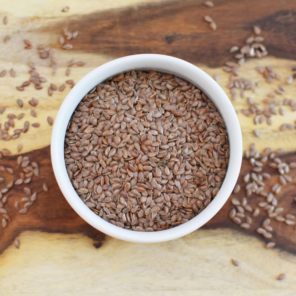 Anthony's Organic Brown Flaxseed in a bowl ready to sprinkle.