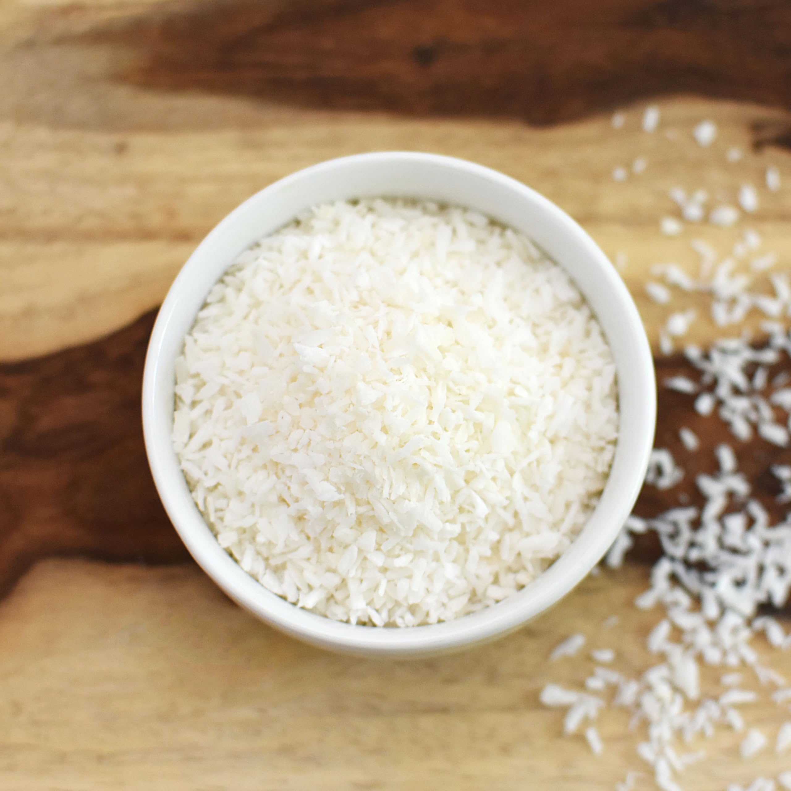 Anthony's Organic Shredded Coconut topping on ice cream for dairy-free sweetness.