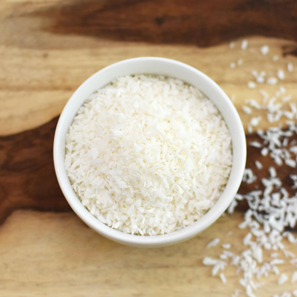 Anthony's Organic Shredded Coconut topping on ice cream for dairy-free sweetness.