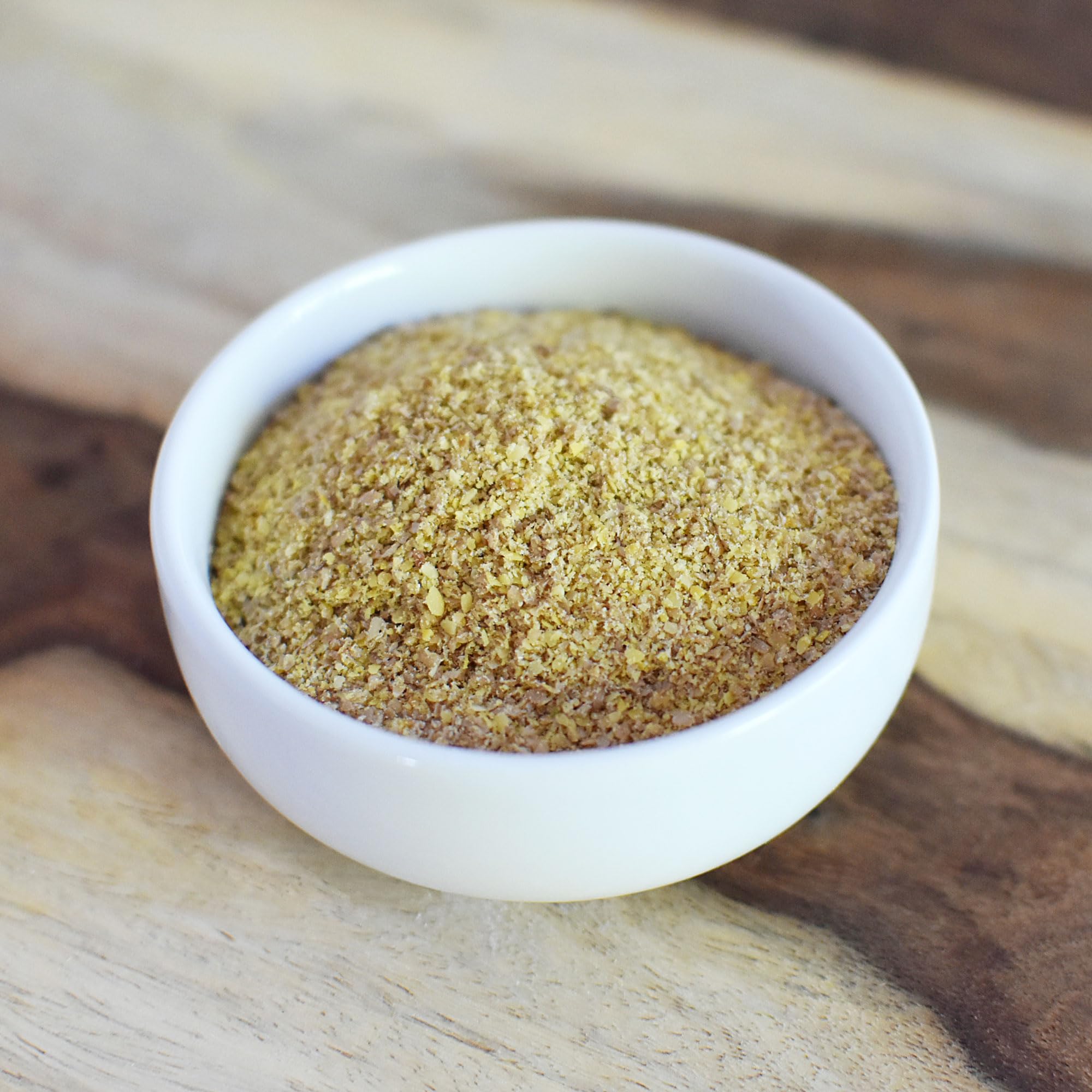 Anthony's Organic Golden Flaxseed Meal on a spoon over oats.