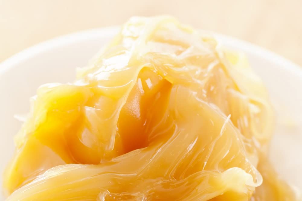 Lanolin jar open illustrating breathable barrier concept for skin protection