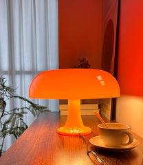 Anykonio orange mushroom lamp side view highlighting its minimalist mid-century silhouette.