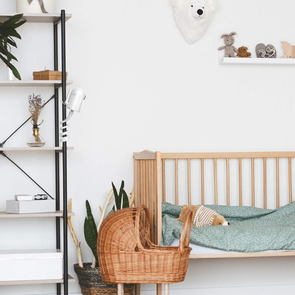 Aobelieve white monitor mount blends with nursery decor.