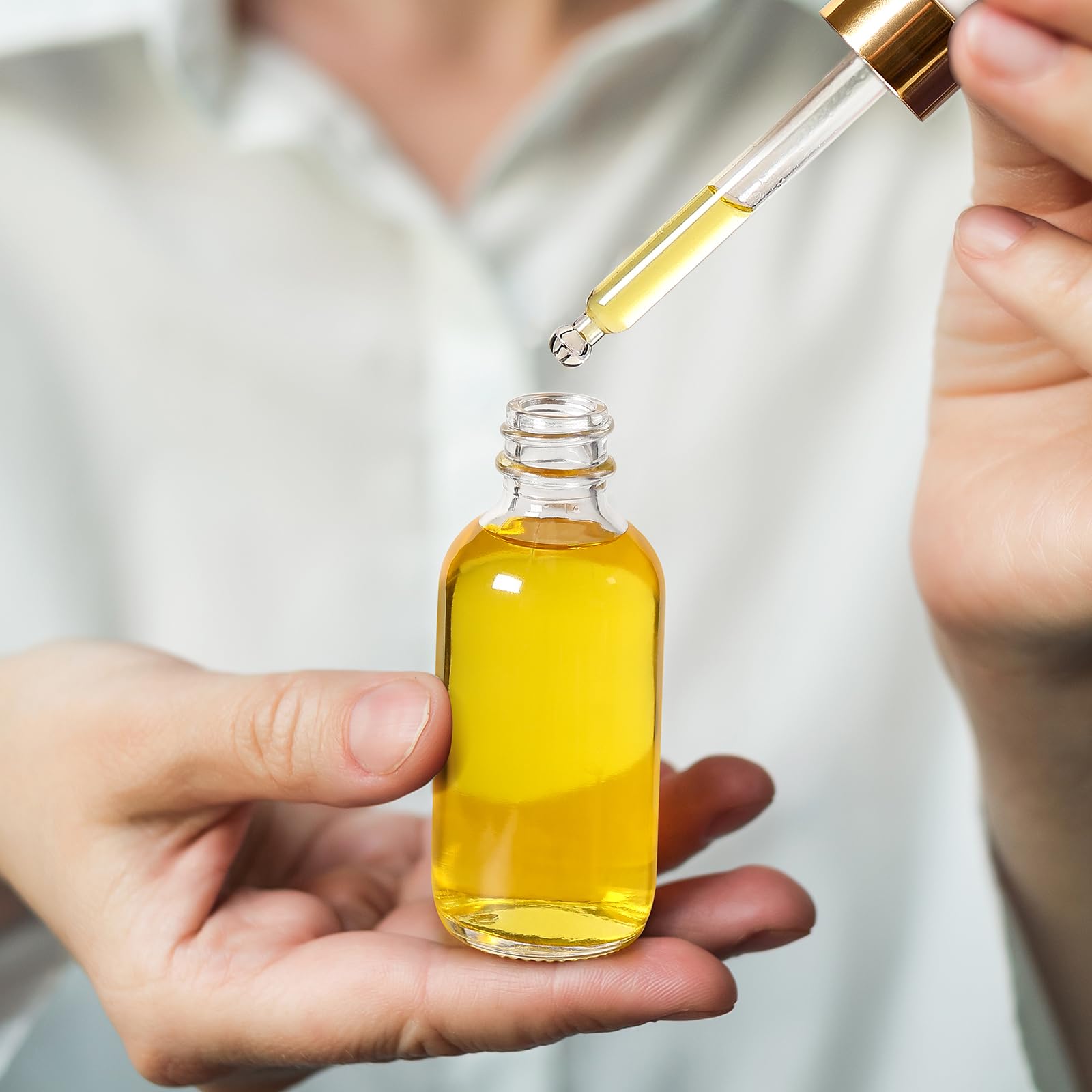 AOZITA bottle pour-cap demonstrates controlled dispensing for tinctures