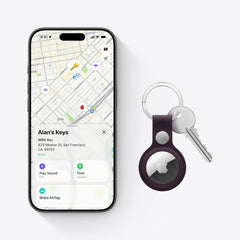 Apple AirTag attached to keys or bag for simple item tracking.