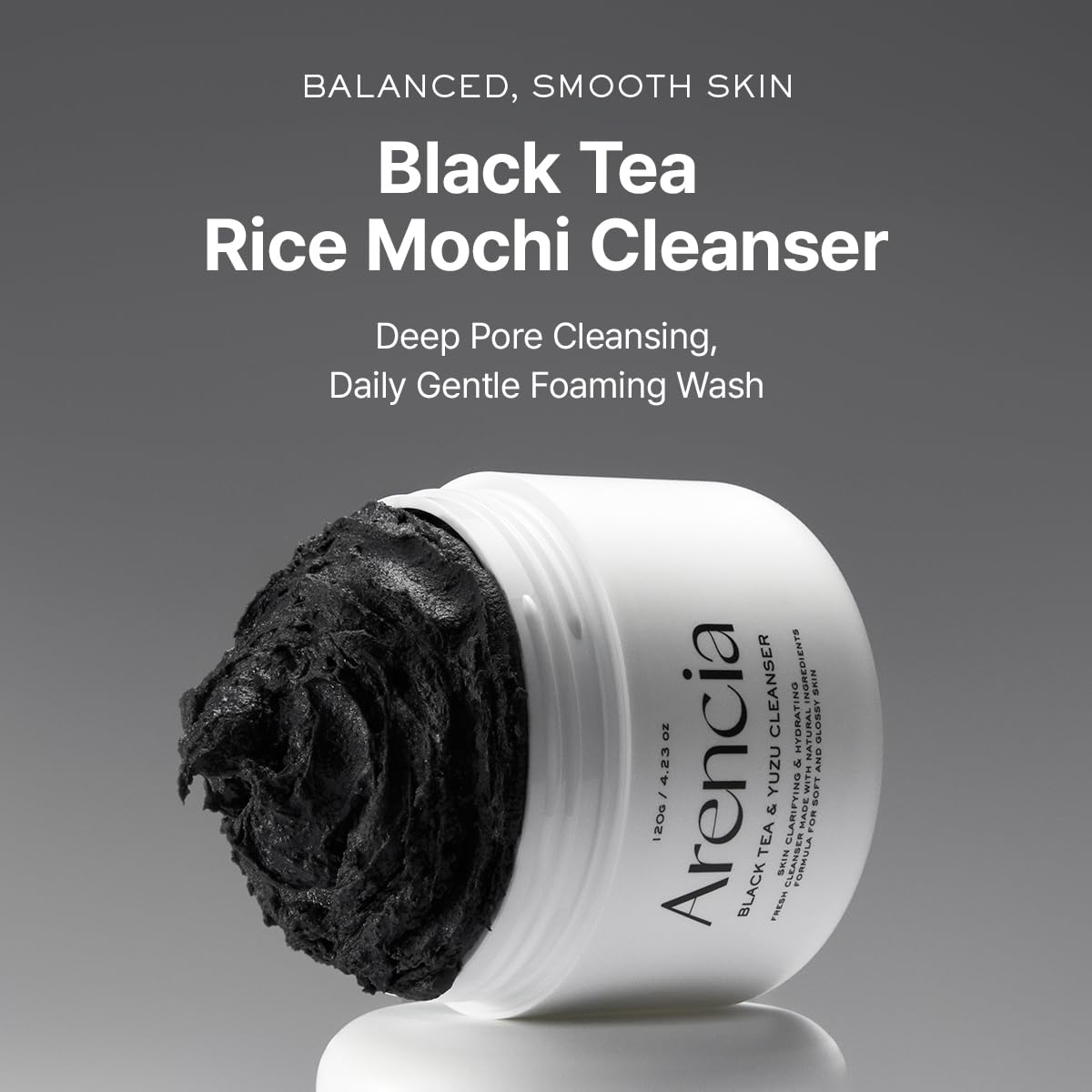 ARENCIA Cleanser texture close-up reveals gentle exfoliating grains for balanced cleansing.
