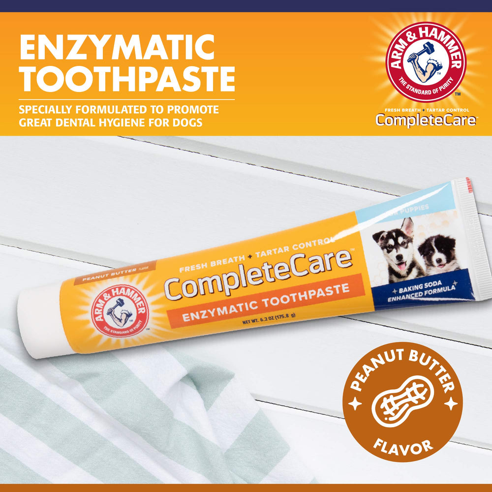 Arm & Hammer enzymatic dog toothpaste for puppies shown with toothbrush to promote gentle cleaning.