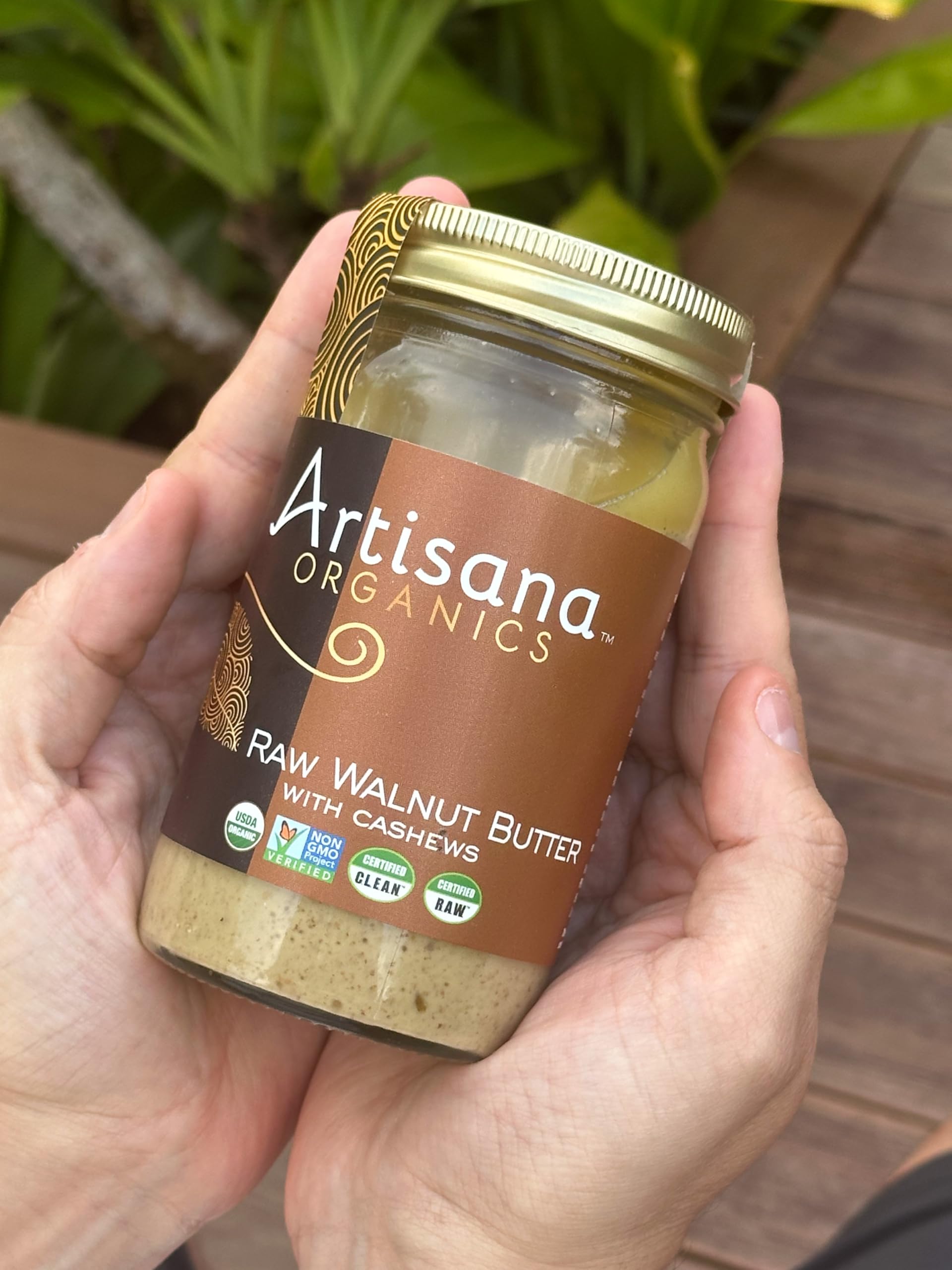 Artisana label on jar emphasizes vegan, non-GMO, gluten-free attributes