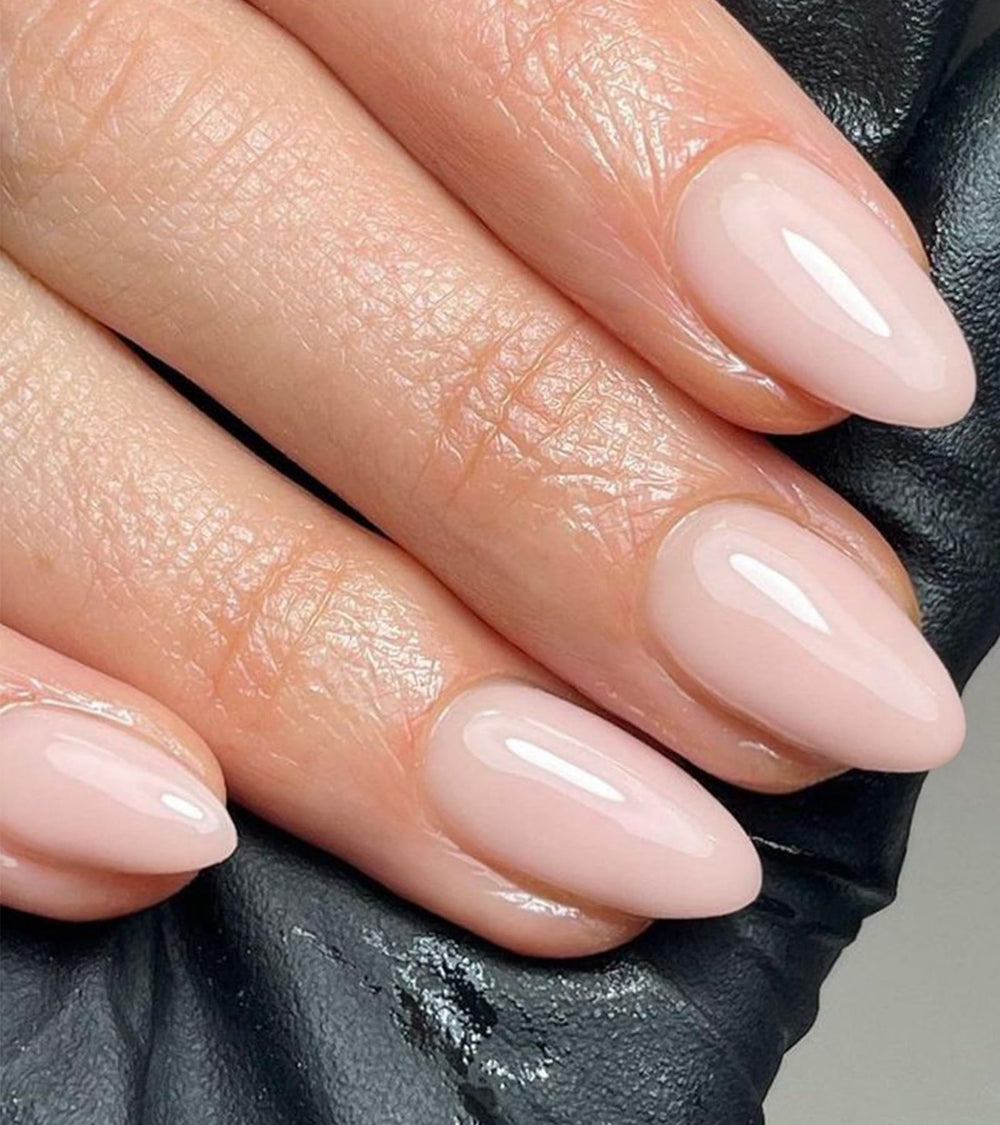 Artquee press-on nails in soft pink almond for everyday elegance
