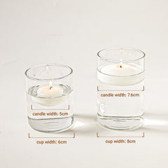 Ashlux floating candle gracefully glows in a glass centerpiece bowl.