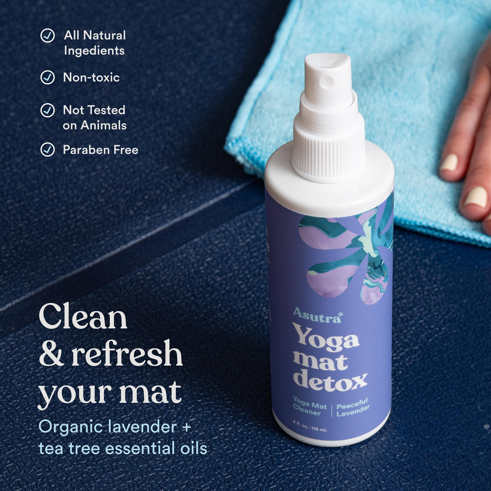 ASUTRA Yoga Mat Cleaner Spray action demonstrating quick surface cleaning