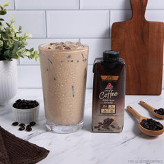 Label closeup on Atkins Café au Lait—15g protein and 3g fiber per serving.