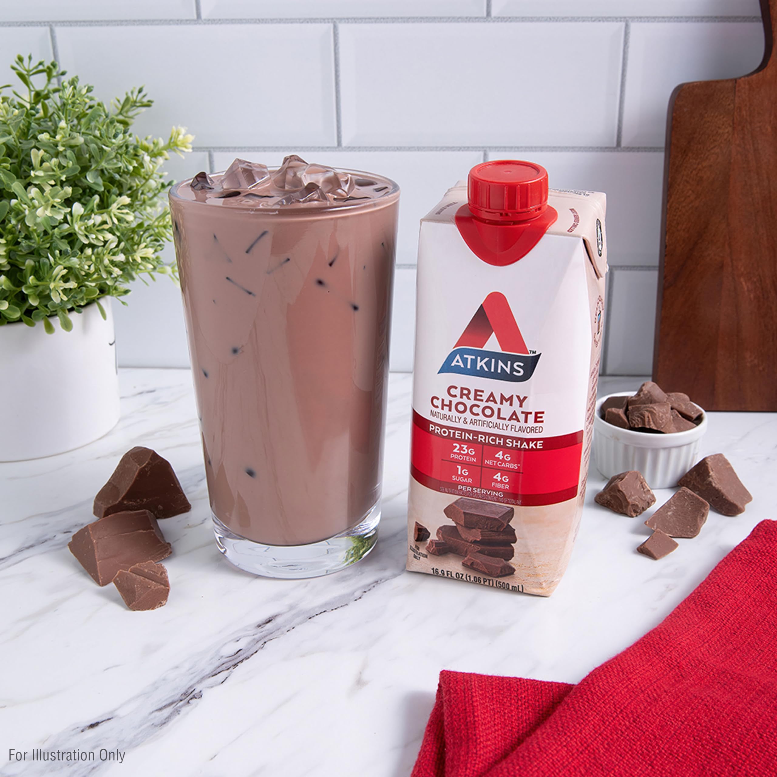 Nutrition facts label on Atkins shake carton highlights low net carbs and fiber.