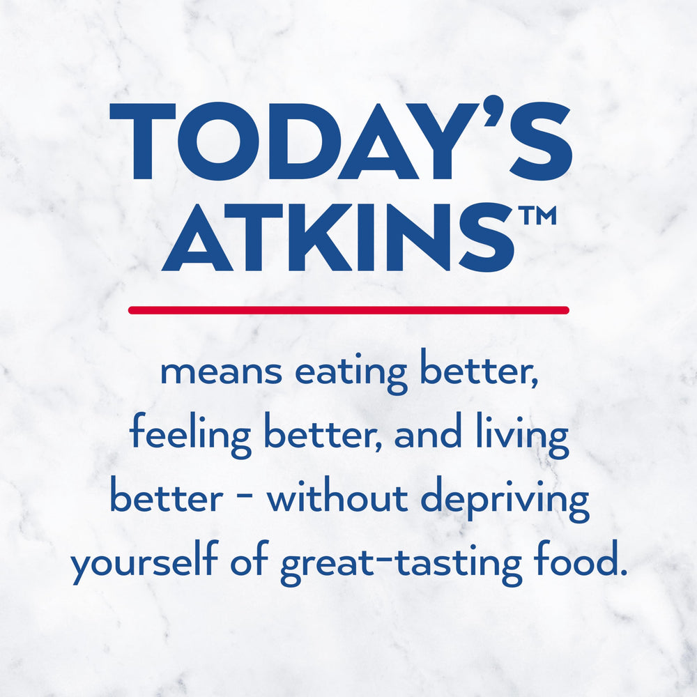 Atkins Peanutty Overload bar served next to a coffee, ready to snack.