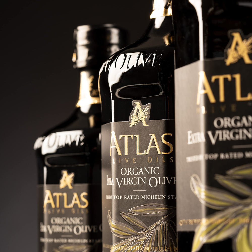 Atlas Olive Oils finishing drizzle over a dish to boost aroma.