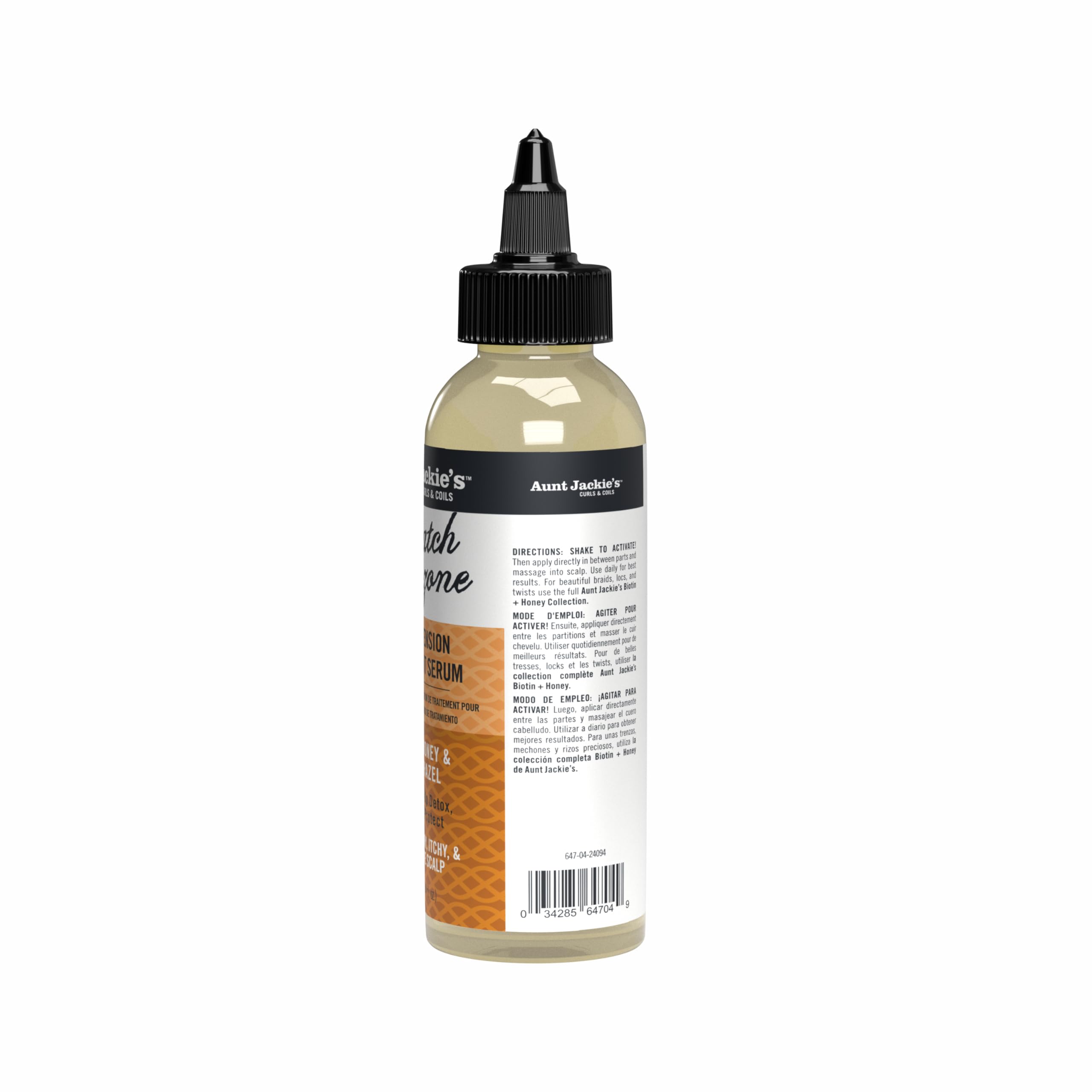 Creamy texture of Aunt Jackie's Braid + Twist Serum closeup near fingers