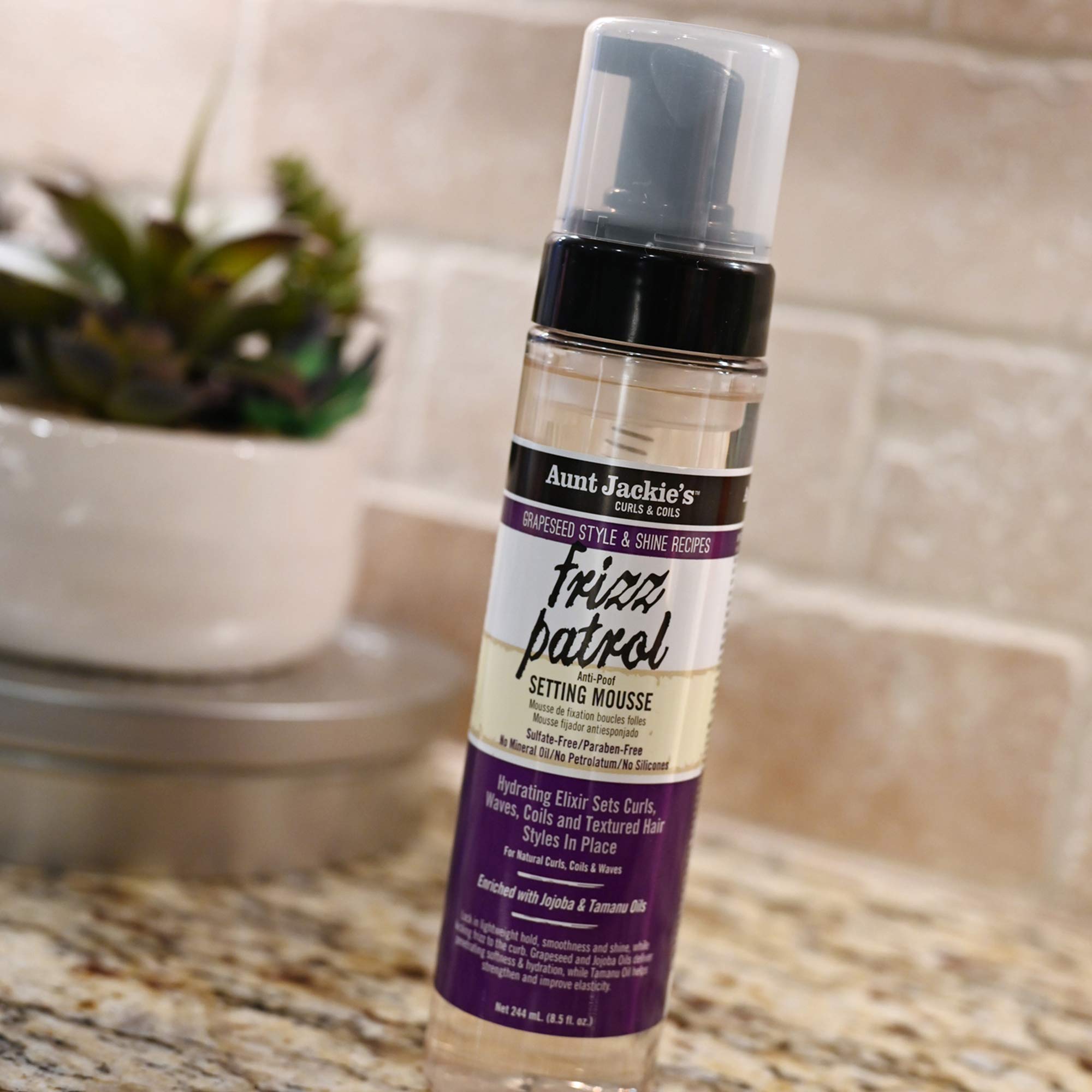 Aunt Jackie's Frizz Patrol mousse on hair adding natural shine.
