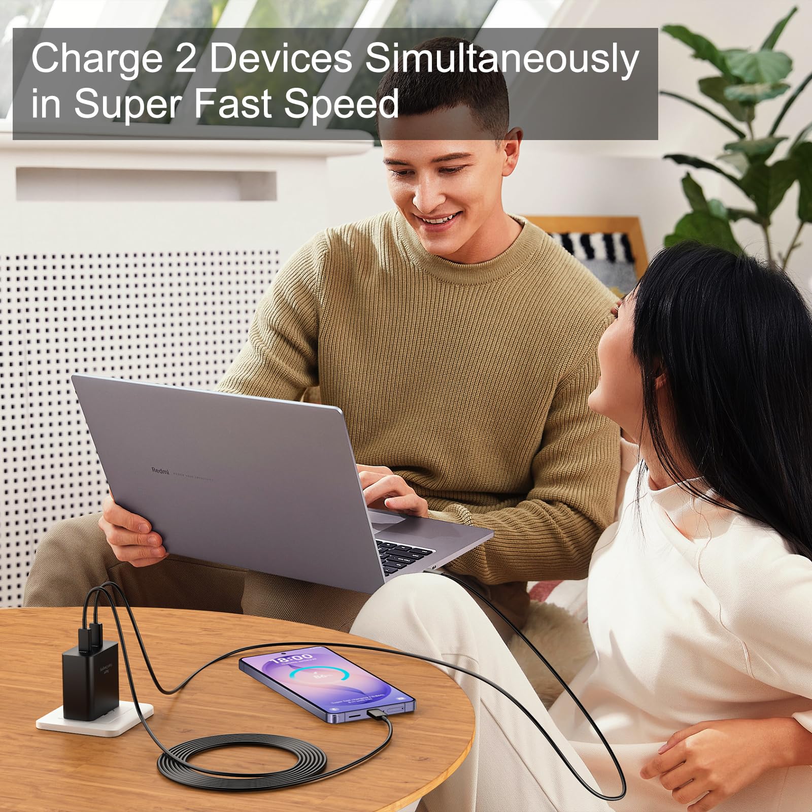 Auorld charging setup on a desk with two devices connected