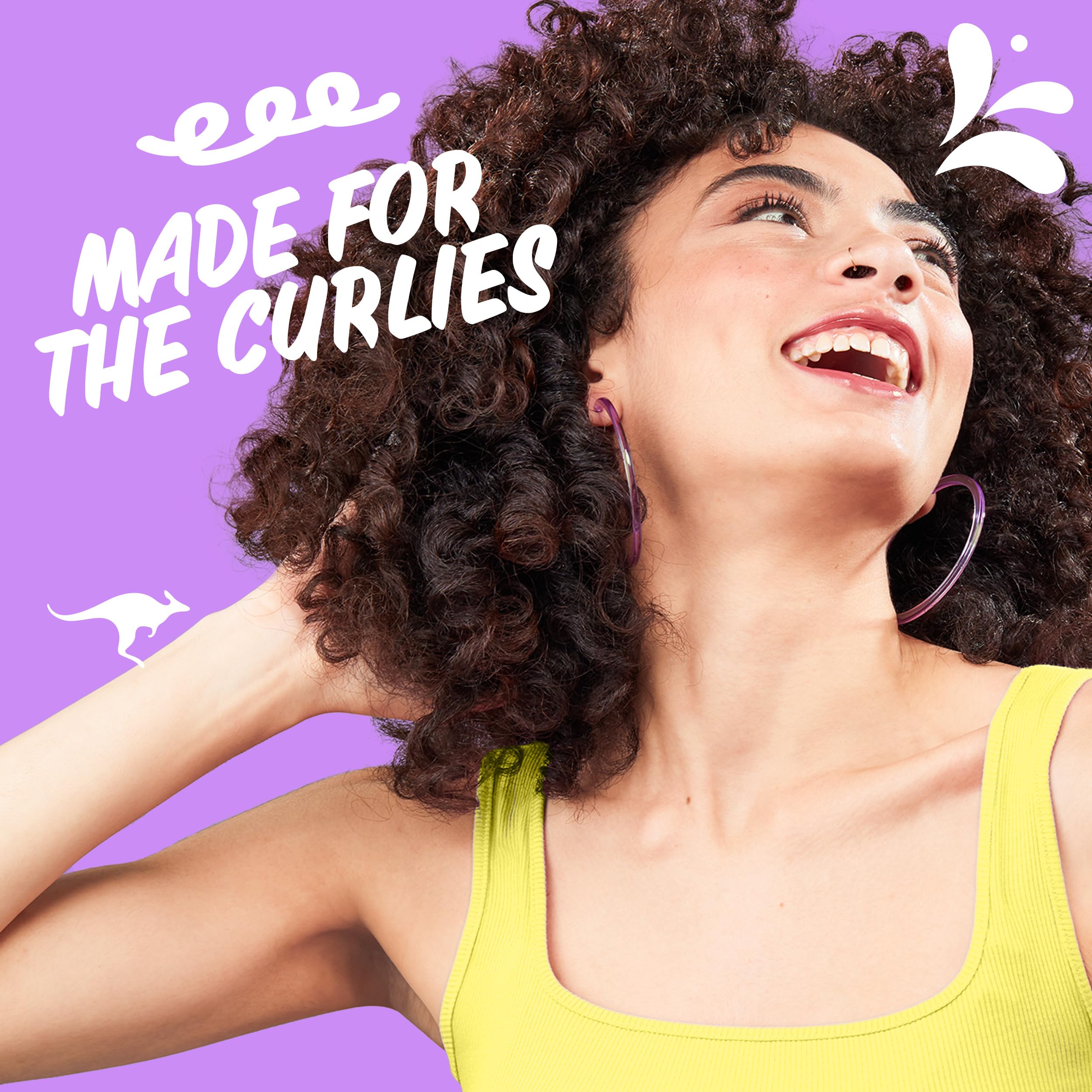 Aussie Miracle Curls detangling milk bottle aids easy combing.