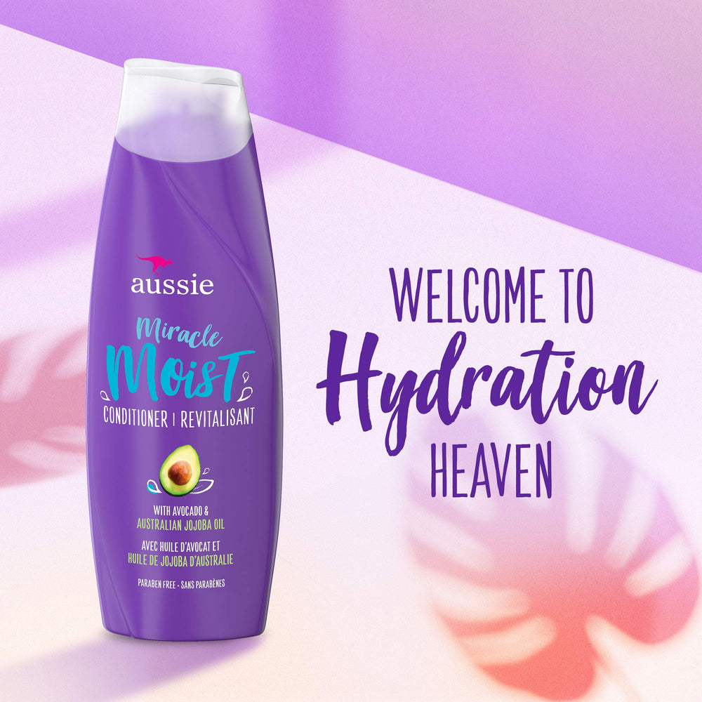 Aussie Miracle Moist conditioner bottle front highlights avocado and jojoba oil nourishment.