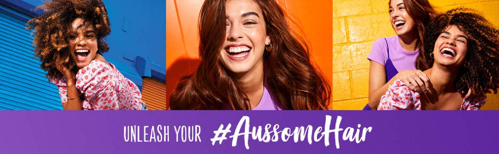 Aussie Miracle Moist conditioner on sink counter implies slip-through softness.