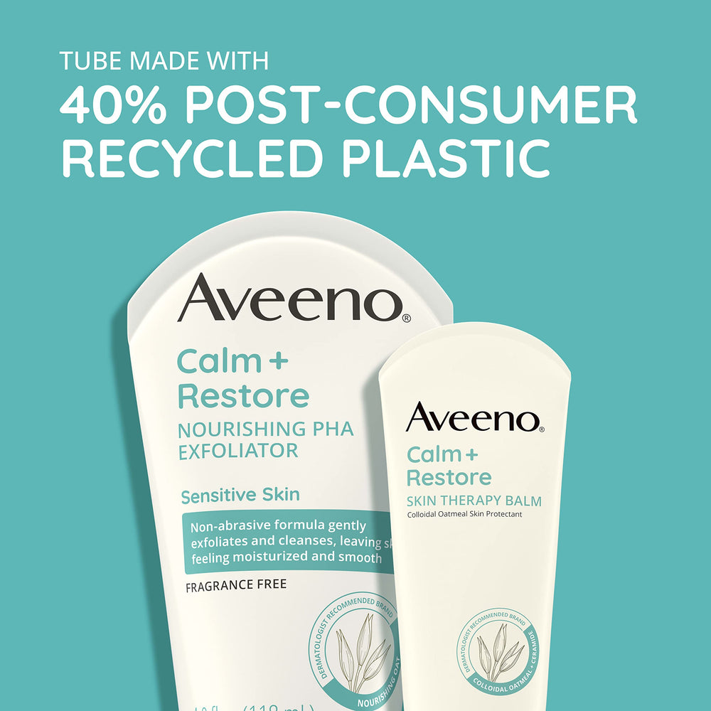 Aveeno Calm + Restore Exfoliator applied on hand for gentle cleansing routine.