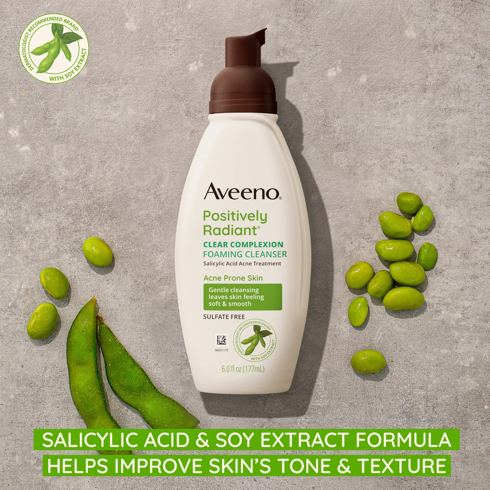 Aveeno Clear Complexion foaming bottle closeup showing gentle cleansing.
