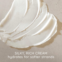 Aveeno conditioner foamy-lather on hair demonstrating gentle cleansing and body.