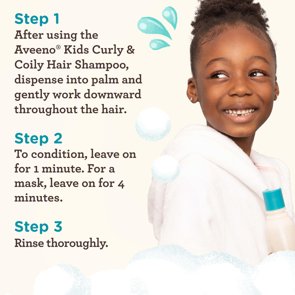 Application of Aveeno Kids Coily Hair Conditioner through toddler hair for soft coils.