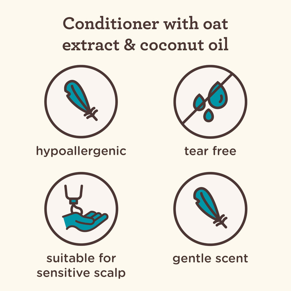 Creamy formula of Aveeno Kids Coily Hair Conditioner visible on hair surface.