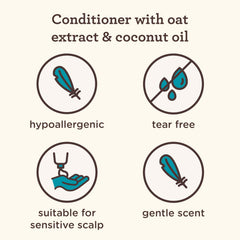 Creamy formula of Aveeno Kids Coily Hair Conditioner visible on hair surface.