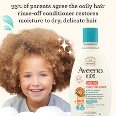 Close-up of Aveeno Kids conditioner being poured for detangling and curl definition.