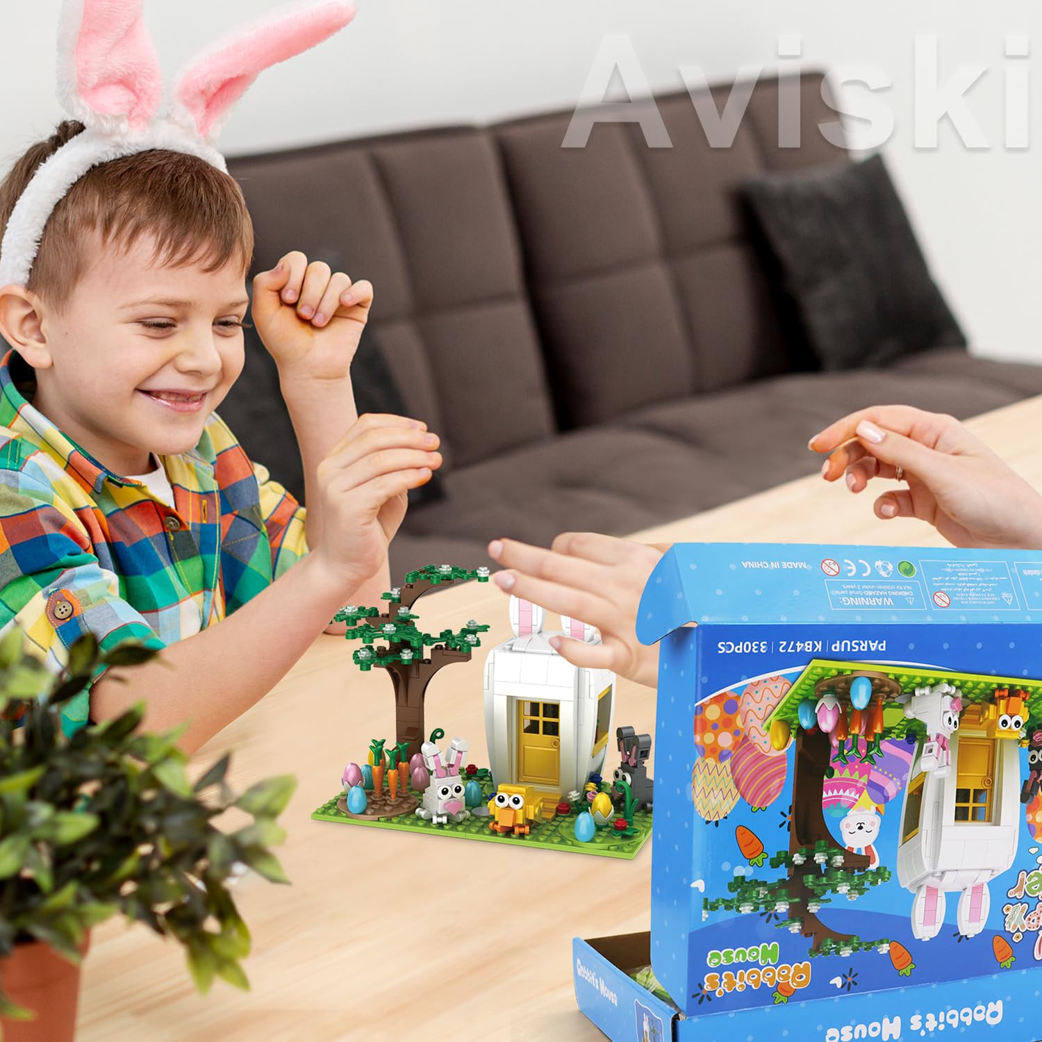 Aviski family gathering with building blocks for collaborative play