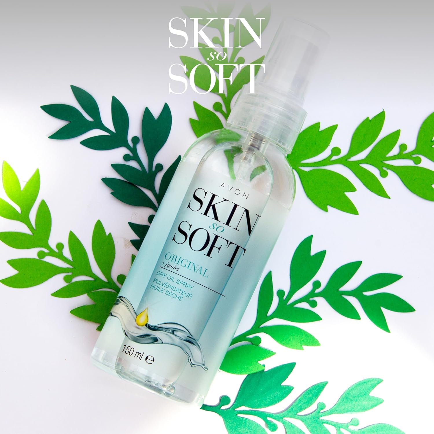 AVON SKIN SO SOFT Jojoba Dry Oil Mist-dispense shows fast-absorbing moisture for skin and hair.