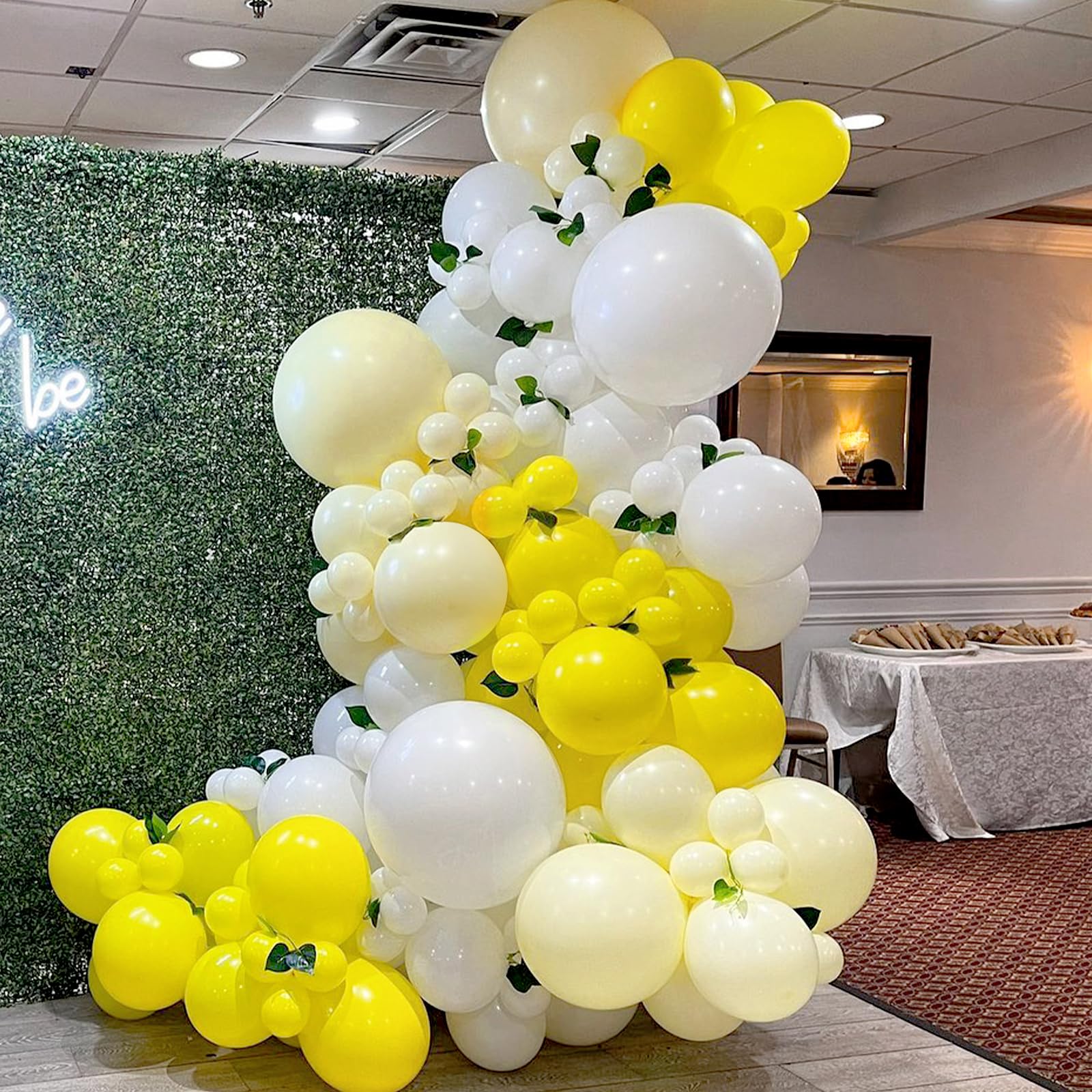 Awenztech balloon arch kit during setup with ribbons.