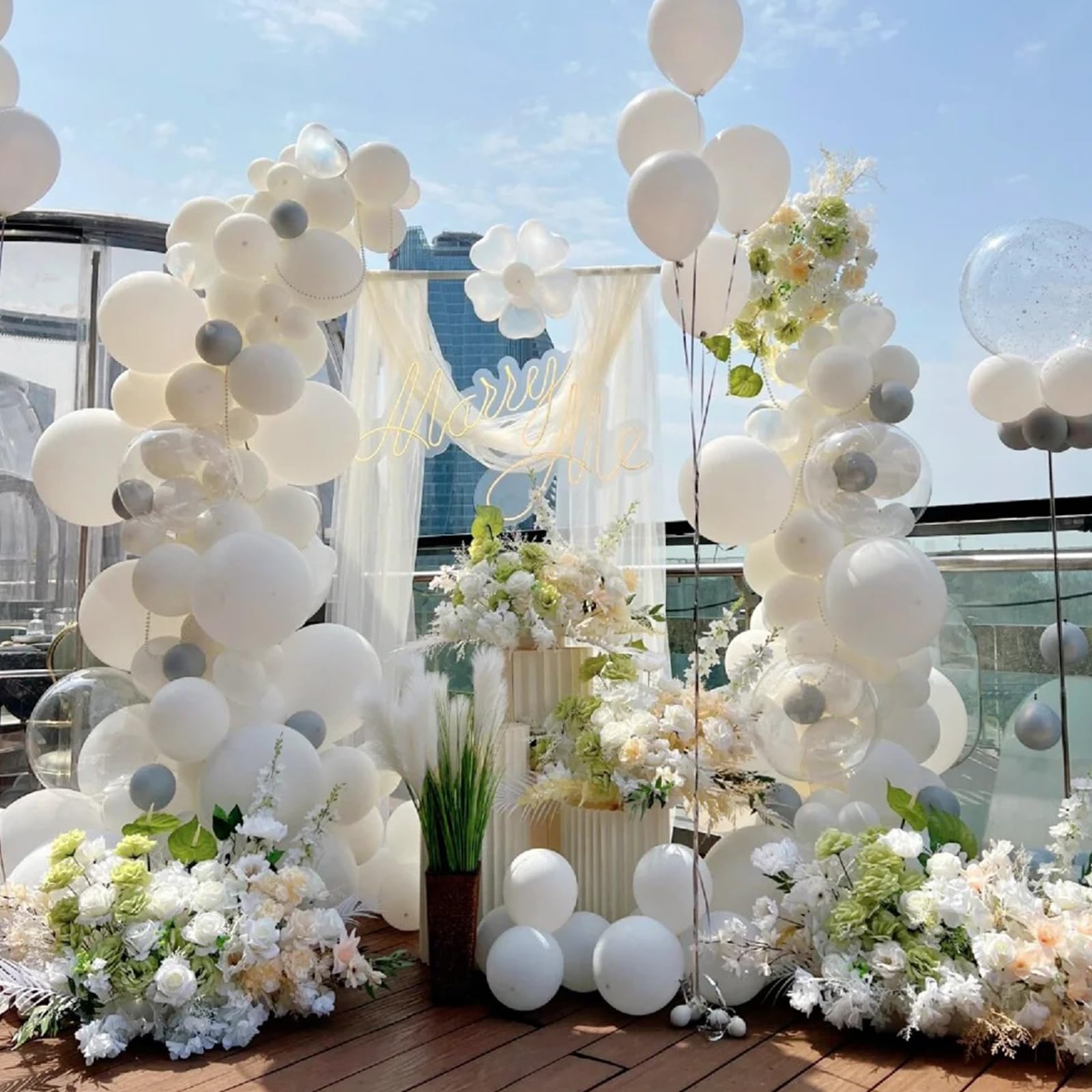 Awenztech white balloons in wedding decor display.