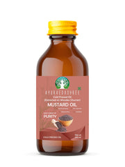 AYURVEDASHREE mustard oil extracted on a wooden churner for rich nutrition.