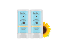 Babo Botanicals Sensitive Baby Mineral Sunscreen Stick SPF 50 gliding onto delicate skin for protection.