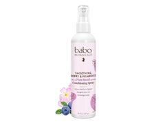 Babo Botanicals smoothing berry conditioning spray bottle for gentle detangling and frizz control.