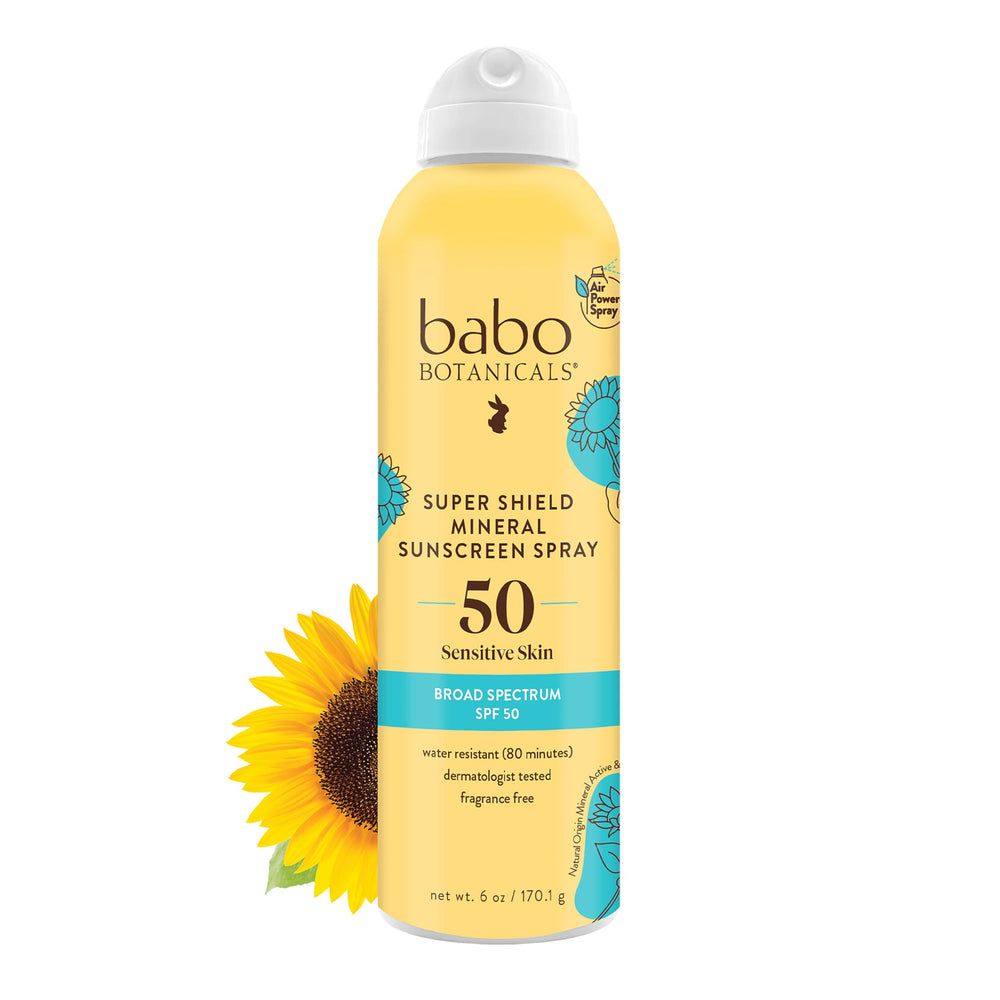 Babo Botanicals Super Shield spray bottle applied to skin for quick, even coverage.