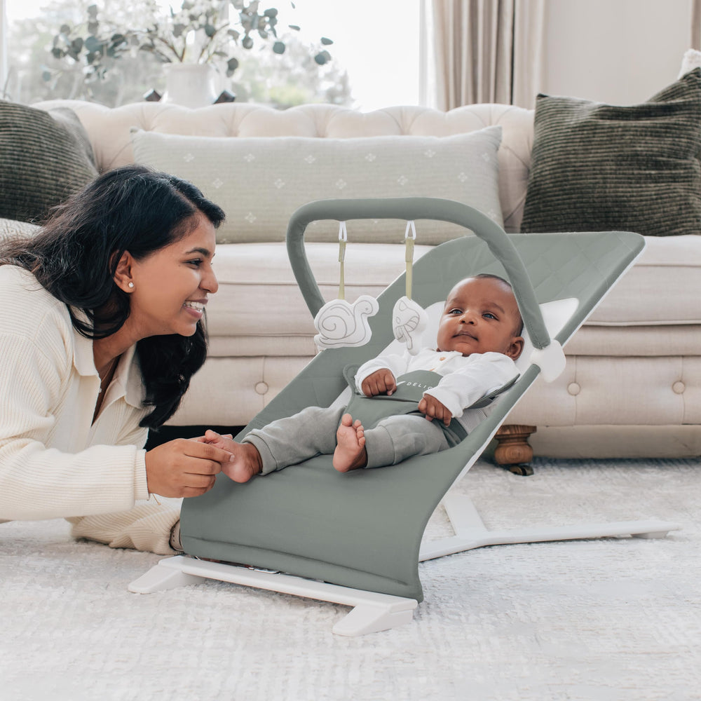 Baby Delight Alpine Deluxe Bouncer in recline position for comfortable play.