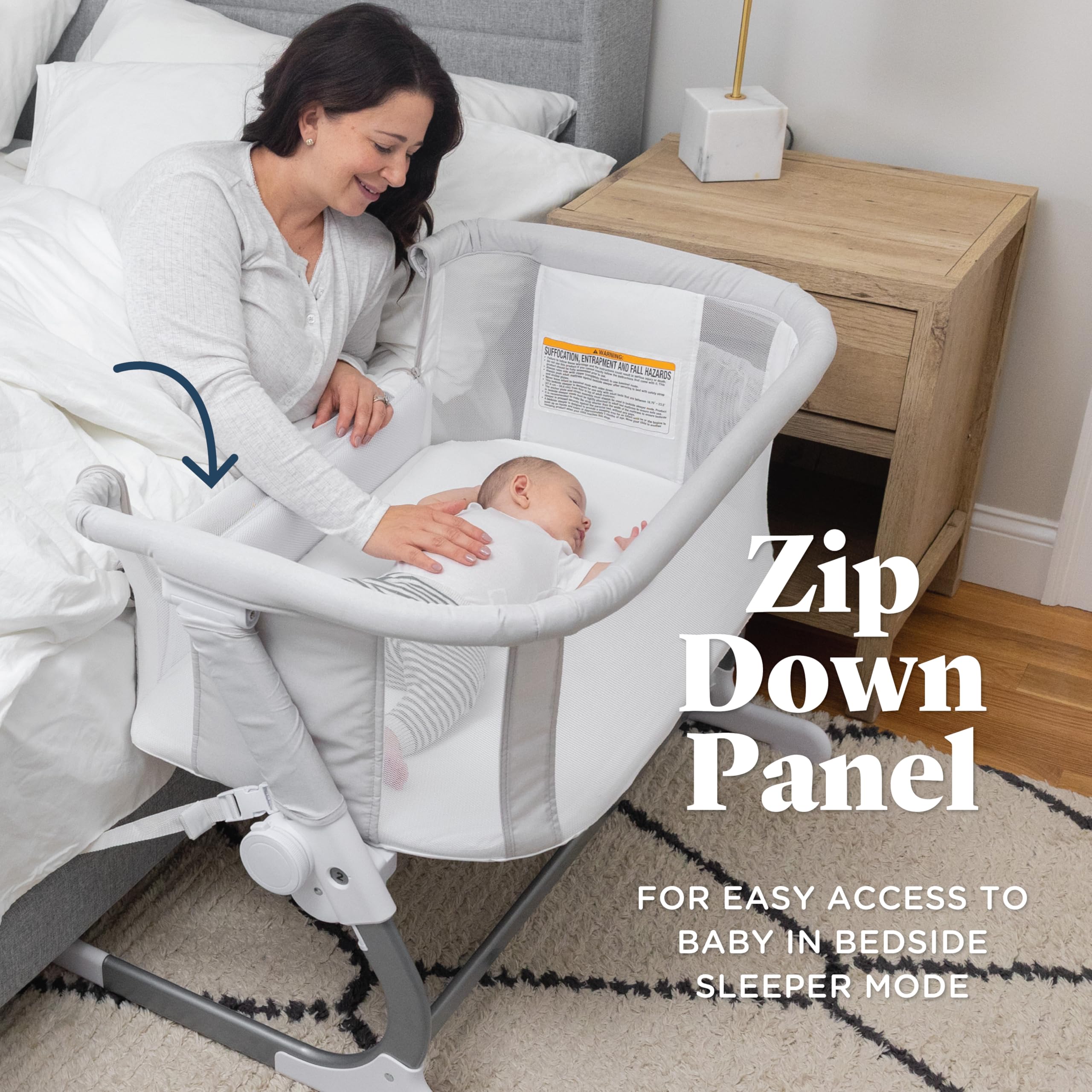 Baby Delight Beside Me Dreamer Bassinet 6-position height adjusts to fit most beds.