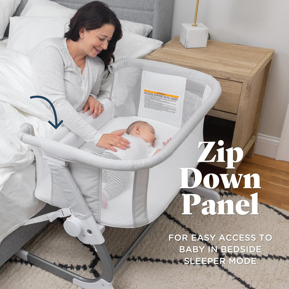 Baby Delight Beside Me Dreamer Bassinet 6-position height adjusts to fit most beds.